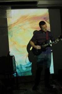 Viewer interacting with the software with his guitar