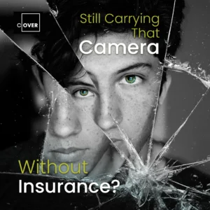 A young man looks directly at the viewer through a broken camera lense and wording titled " Still Carrying that Camera without Insurance?"